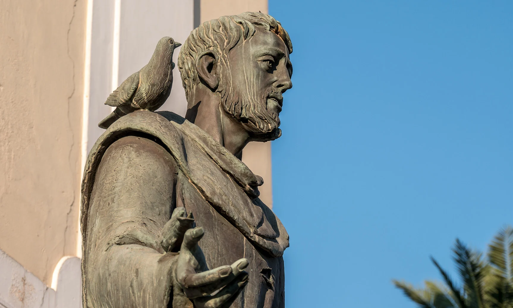 St. Francis statue with bird